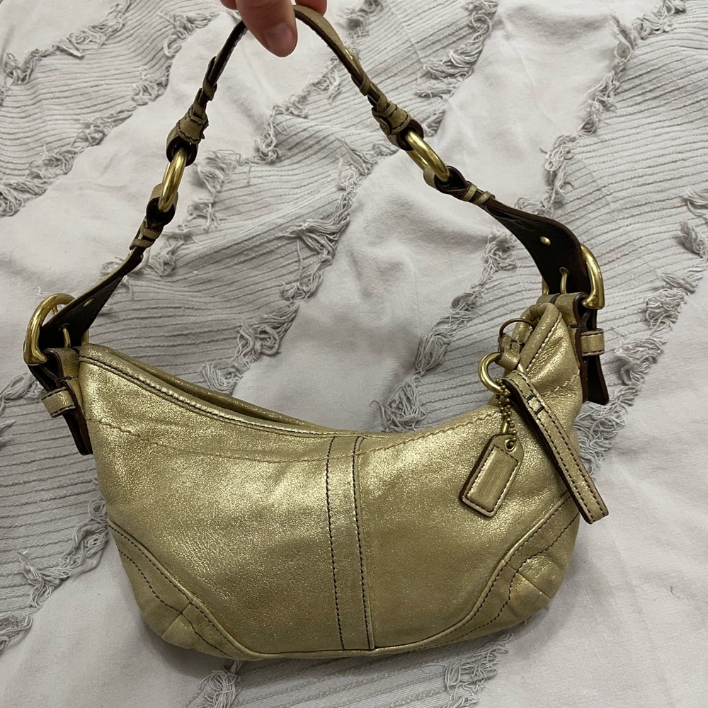 Coach women’s gold mini shoulder bag